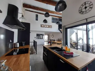 a kitchen with a sink and a counter top at La Cave... entre Narbonne et Carcassonne in Conilhac-Corbières