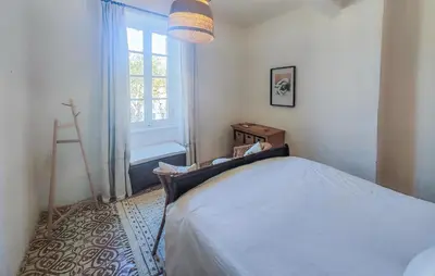 a bedroom with a bed and a window at Nice Home In Saint-Chinian With Wifi in Saint-Chinian