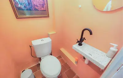 a bathroom with a toilet and a sink at Nice Home In Saint-Chinian With Wifi in Saint-Chinian