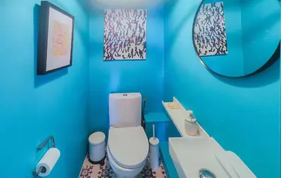 a blue bathroom with a toilet and a sink at Nice Home In Saint-Chinian With Wifi in Saint-Chinian
