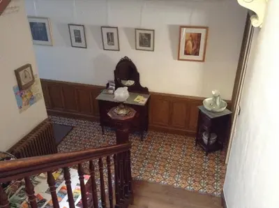 a room with a staircase and a stair case at La Maison de la Riviere B&B in Espéraza