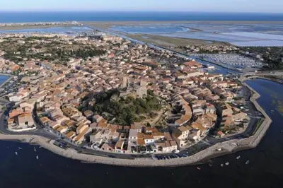 an aerial view of a city next to the ocean at Appartement Iris Résidence les Grenadines in Gruissan