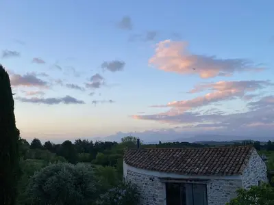 a building with a tile roof with a sky at Casa Bohême in Caunes-Minervois