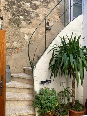 a person is sitting on a stair case at Casa Bohême in Caunes-Minervois