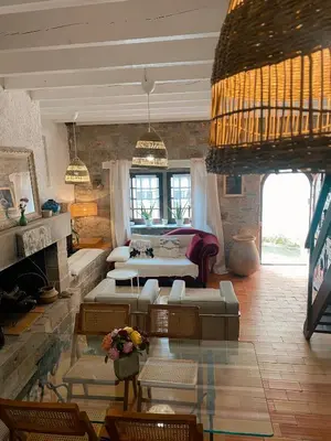 a living room with a couch and a fireplace at Casa Bohême in Caunes-Minervois