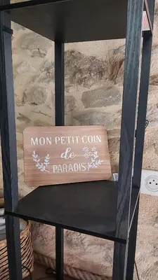 a chair with a sign on the back of it at La Grange du Pradel in Montredon-Labessonnié