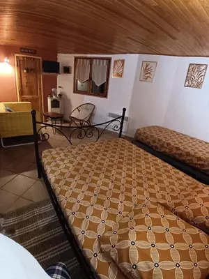 a bedroom with two beds in a room at Chambre d'hôte Les maisons de Gaia in Tuchan