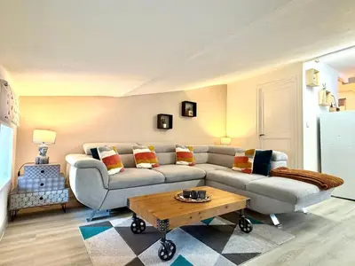 a living room with a couch and a coffee table at La Comtale in Carcassonne
