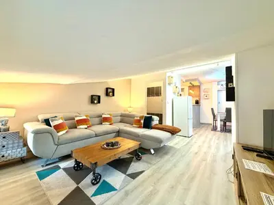 a living room with a couch and a table at La Comtale in Carcassonne