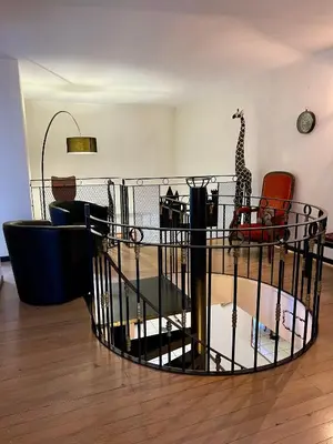 a cage with a giraffe in a room at Côté Cité appartements - Parking privé - 100m Cité médiévale in Carcassonne