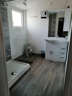 a bathroom with a sink and a mirror at Le Bleu du Sud in Gruissan