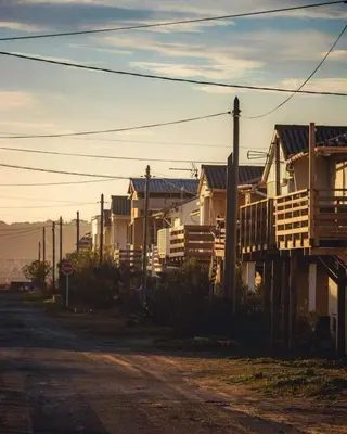 a row of houses on the side of a street at Le Bleu du Sud in Gruissan