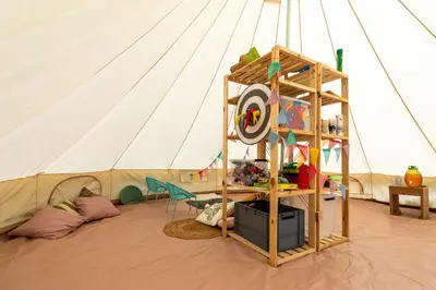 a tent with a shelf and a ladder in a room at Camping maeva Respire La Serre in Aigues-Vives