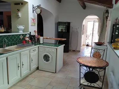 a kitchen with a washing machine and a sink at Château Winery la Batisse le minervois in La Redorte