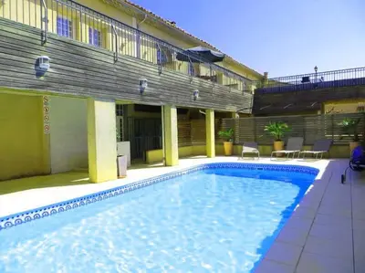 a large swimming pool in front of a building at Château Winery la Batisse le minervois in La Redorte