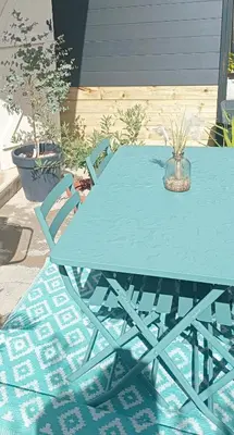 a blue picnic table with two chairs around it at Studio Oasis Narbonne Terrasse & Calme in Narbonne