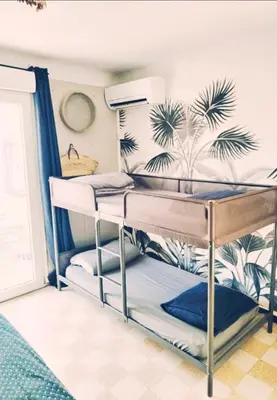a bunk bed room with two bunk beds in it at Studio Oasis Narbonne Terrasse & Calme in Narbonne