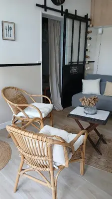 a living room with two chairs and a table at La maison de Mona in Carcassonne