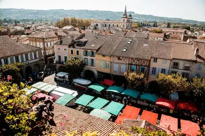 an overhead view of a city with buildings and roofs at Charmante Maison de Village T3 Rénovée et son Jardin in Revel