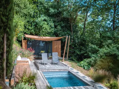 a swimming pool with two chairs and a gazebo at Évasion champêtre à Horizon P'y - Piscine in Puéchoursi