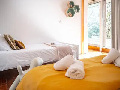 a room with two beds with towels on the floor at Évasion champêtre à Horizon P'y - Piscine in Puéchoursi