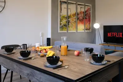 a wooden table with fruit on top of it at Magnifique*T4*centre ville*WIFI*Billard*Netflix* in Limoux