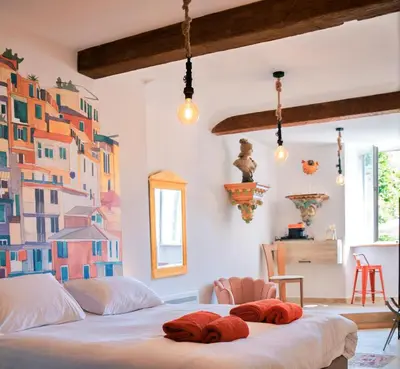a bedroom with a bed with towels on it at Le1693 - Charme & confort 4 étoiles - Jacuzzi in Limoux