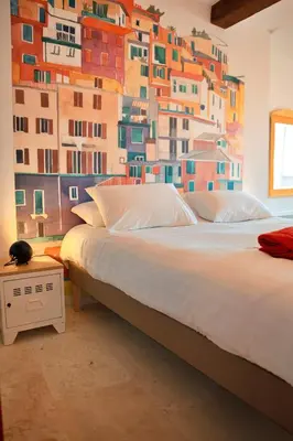 a bedroom with two beds with a painting on the wall at Le1693 - Charme & confort 4 étoiles - Jacuzzi in Limoux