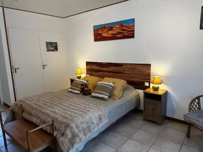 a bedroom with a bed with a teddy bear on it at Oasis Des Corbières in Boutenac