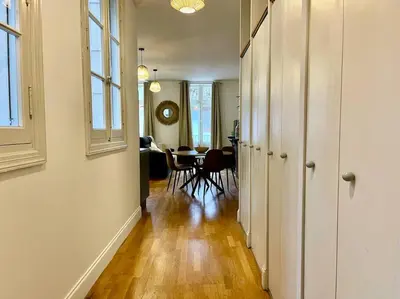 a hallway with a table and chairs in a room at Le Petit Balcon de Verdun - Carcassonne centre in Carcassonne