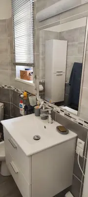 a bathroom with a white sink and a mirror at Suite Napoléon - La Halte d'Eugénie in Félines-Termenès