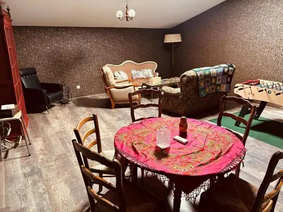 a living room with a table and chairs at La Babayaga in Capestang