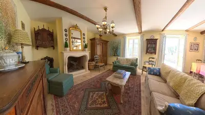 a living room with a couch and a fireplace at Bijou- Charming Traditional Home with Pool in Minervois in Saint-Jean-de-Minervois