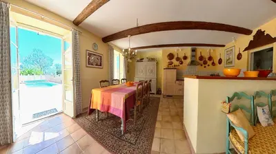 a kitchen and dining room with a table and a kitchen at Bijou- Charming Traditional Home with Pool in Minervois in Saint-Jean-de-Minervois