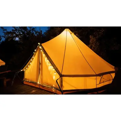a large yellow tent with lights on it at Lodge tente les pommiers Glamping Ô rendez-vous en demi-pension in Roquefeuil
