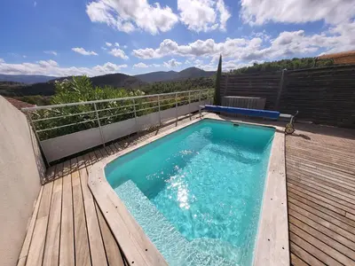 a small swimming pool on a wooden deck at Superb villa for 4, private pool in Durban-Corbières