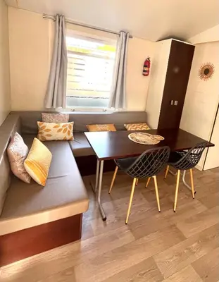 a small room with a bed and a window at Entre Mer et Roseaux - Piscine chauffée - Proche centre et mer - Animaux bienvenus in Port-la-Nouvelle