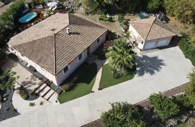 an overhead view of a house with a pool at Les oliviers Puisserguier in Puisserguier