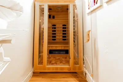 a closet with a glass door in a room at 2 bedrooms apartment - Perfect for a city getaway in Carcassonne