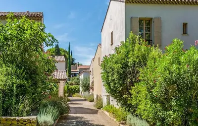 an alley in a village with trees and a building at Gorgeous Home In Saint-Laurent-De-La-Ca in Saint-Laurent-de-la-Cabrerisse