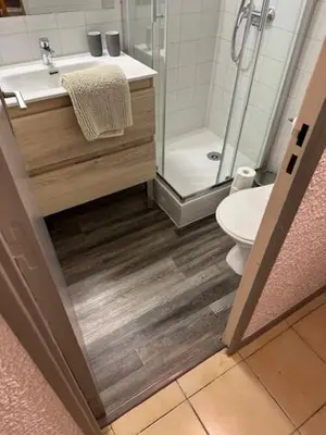 a bathroom with a shower and a sink and a toilet at VILLA DU PIN in Gruissan