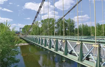a bridge over a river with cars on it at Holiday Home Cessenon Sur Orb Mn-1265 in Cessenon