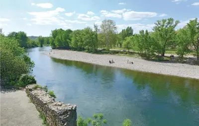 a view of a river with people on the beach at Holiday Home Cessenon Sur Orb Mn-1265 in Cessenon