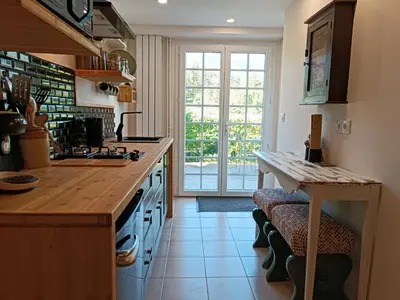 a kitchen with a counter and a large window at Coste de Laval in Quillan