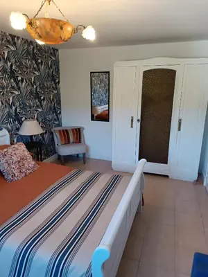 a bedroom with a large bed in a room at Coste de Laval in Quillan