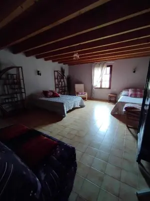 a large room with two beds and a couch at Amé-lys in Véraza