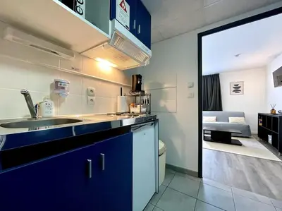 a kitchen with a sink and a counter top at Zen studio ※ parking - piscine in Carcassonne