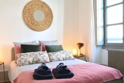 a bedroom with a bed with towels on it at Grand Appartement Hyper Centre Castres 5 Chambres 10 personnes in Castres