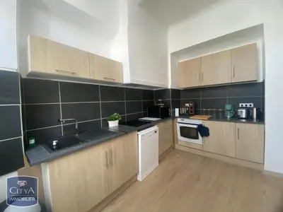 a kitchen with a sink and a stove top oven at Grand Appartement Hyper Centre Castres 5 Chambres 10 personnes in Castres
