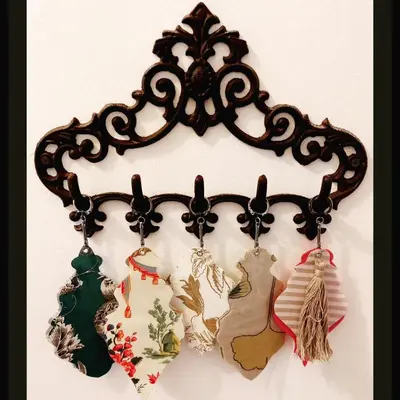 a group of necklaces hanging on a wall at Grand Appartement Hyper Centre Castres 5 Chambres 10 personnes in Castres